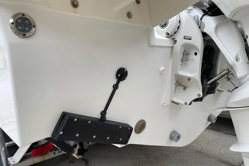 Slide: The Image of 2024 Jeanneau Leader 10.5 CC boat interior with seating and table. - 17