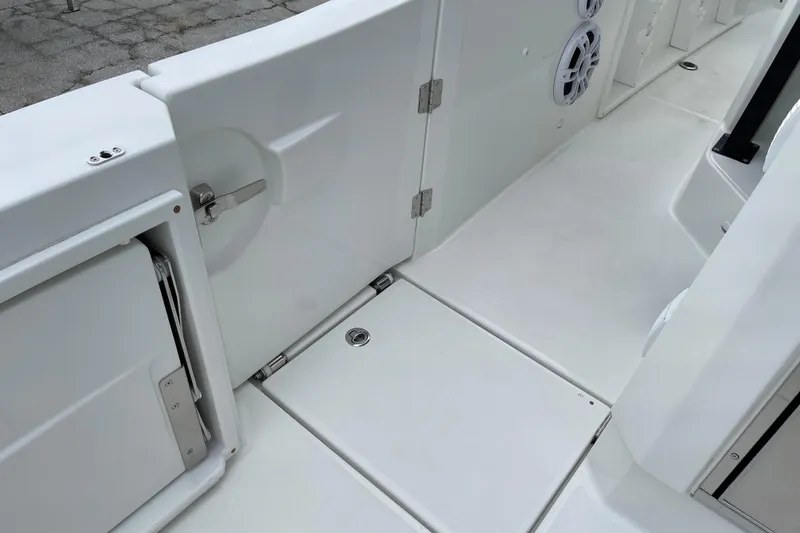 Slide: The Image of 2024 Jeanneau Leader 10.5 CC boat kitchen with sink, grill, and storage. - 6