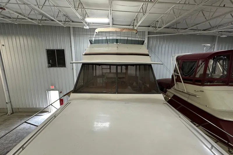 Slide: The Image of 1982 Egg Harbor 42 Flybridge Motoryacht in indoor storage, front view. - 14