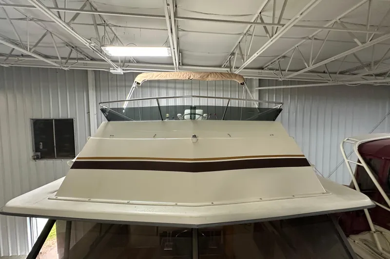 Slide: The Image of 1982 Egg Harbor 42 Flybridge Motoryacht in indoor storage, showcasing its classic design. - 15