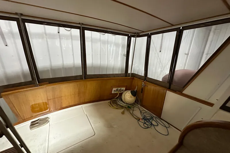 Slide: The Image of 1982 Egg Harbor 42 Flybridge Motoryacht interior with wood paneling and coiled ropes. - 17