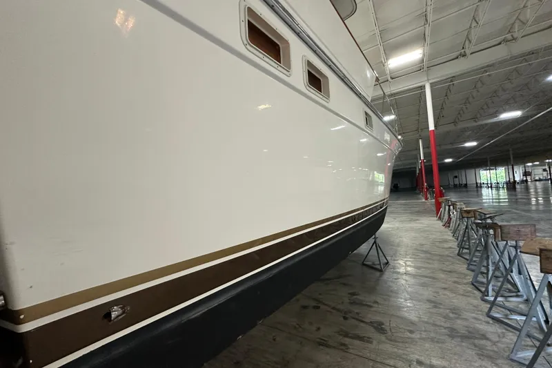Slide: The Image of 1982 Egg Harbor 42 Flybridge Motoryacht in indoor storage, side view. - 2