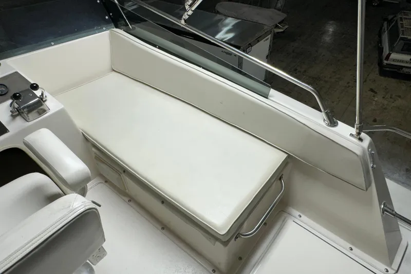 Slide: The Image of 1982 Egg Harbor 42 Flybridge Motoryacht interior with white seating and control panel. - 23