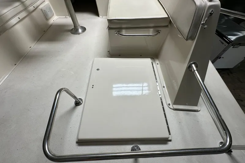 Slide: The Image of 1982 Egg Harbor 42 Flybridge Motoryacht interior with seating and stainless steel railing. - 29