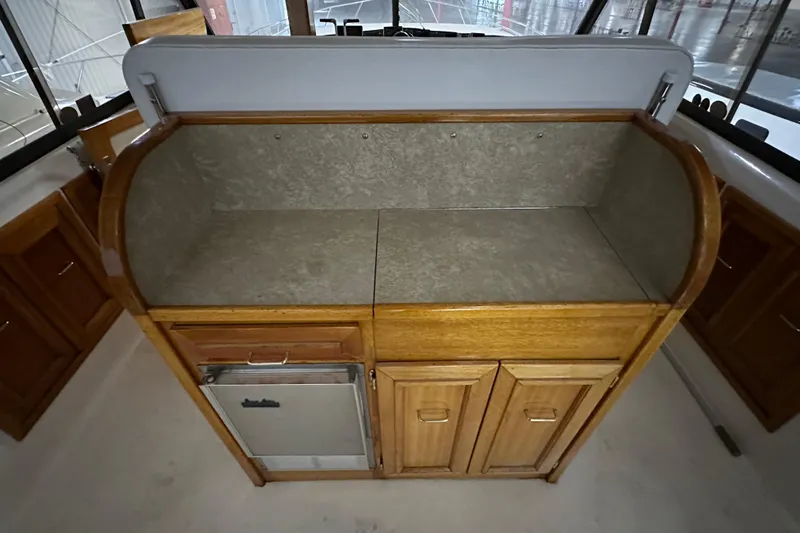 Slide: The Image of 1982 Egg Harbor 42 Flybridge Motoryacht interior with wooden cabinetry and countertop. - 30