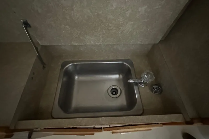 Slide: The Image of Stainless steel sink in 1982 Egg Harbor 42 Flybridge Motoryacht kitchen area. - 32