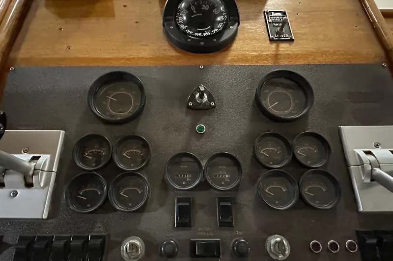 Slide: The Image of Instrument panel of a 1982 Egg Harbor 42 Flybridge Motoryacht with gauges and controls. - 40