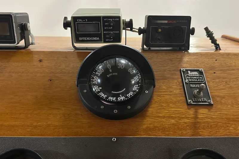 Slide: The Image of Dashboard of 1982 Egg Harbor 42 Flybridge Motoryacht with compass and controls. - 43