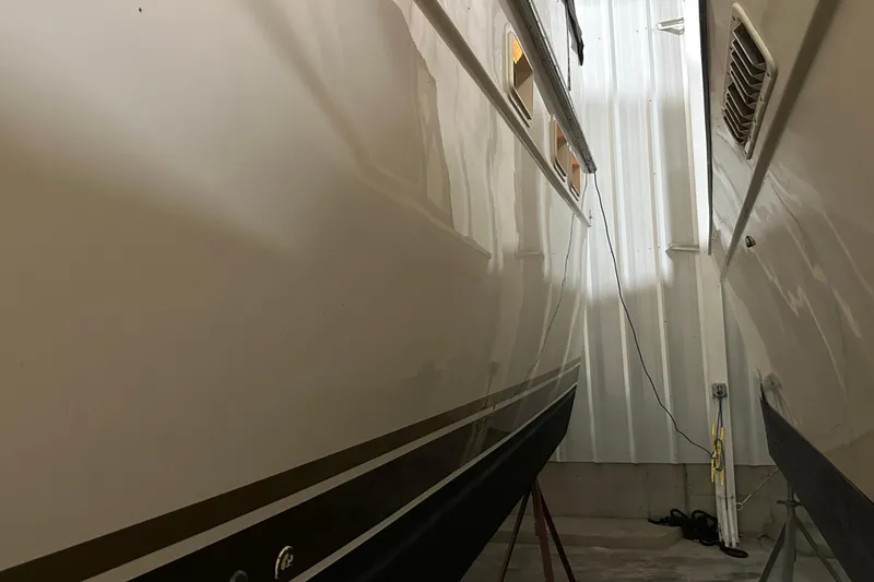 Slide: The Image of 1982 Egg Harbor 42 Flybridge Motoryacht in storage, side view of hull. - 5