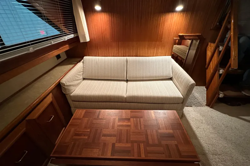 Slide: The Image of Interior of 1982 Egg Harbor 42 Flybridge Motoryacht with sofa and wooden table. - 53
