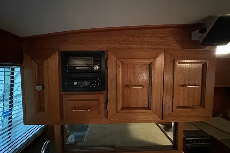 Slide: The Image of Wooden cabinetry with built-in stereo system on 1982 Egg Harbor 42 Flybridge Motoryacht. - 56