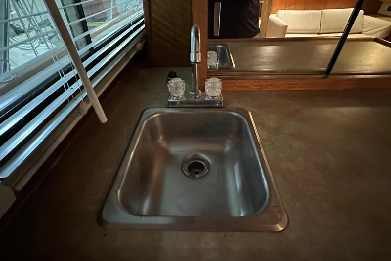 Slide: The Image of Stainless steel sink in 1982 Egg Harbor 42 Flybridge Motoryacht interior. - 57