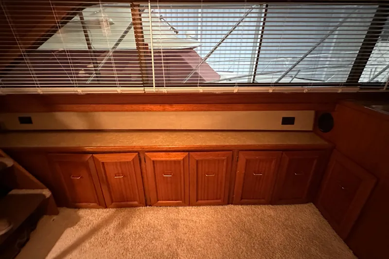 Slide: The Image of Interior of 1982 Egg Harbor 42 Flybridge Motoryacht with wooden cabinets and carpeted floor. - 58