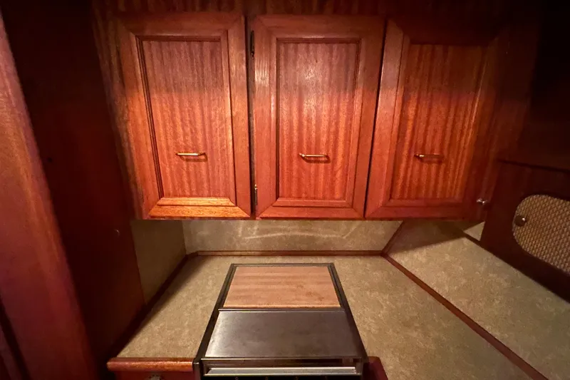 Slide: The Image of 1982 Egg Harbor 42 Flybridge Motoryacht interior with wooden cabinets and countertop. - 66