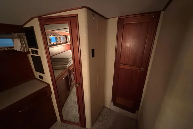 Slide: The Image of Interior of 1982 Egg Harbor 42 Flybridge Motoryacht, featuring cozy cabin and wooden finishes. - 75