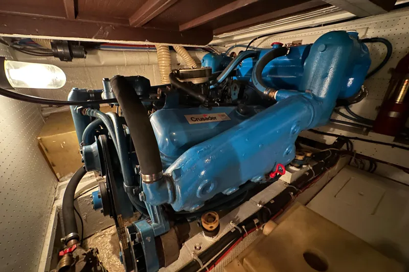 Slide: The Image of Engine room of 1982 Egg Harbor 42 Flybridge Motoryacht with blue Crusader engine. - 77