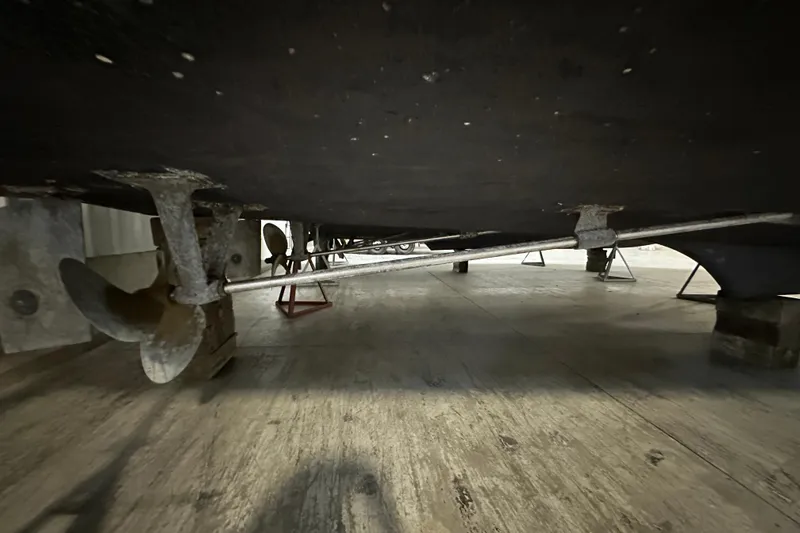 Slide: The Image of 1982 Egg Harbor 42 Flybridge Motoryacht underside showing propeller and shaft detail. - 80