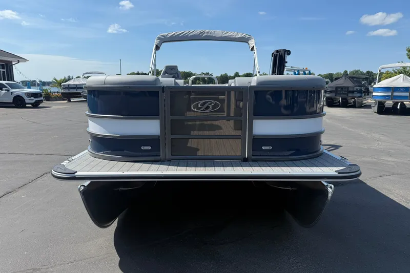 Slide: The Image of 2026 Bentley Pontoons Legacy 240 Cruise XL on display at a marina. - 7