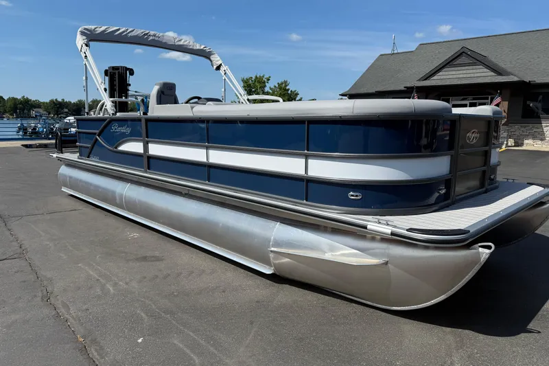 Slide: The Image of 2026 Bentley Pontoons Legacy 240 Cruise XL pontoon boat docked on a sunny day. - 8