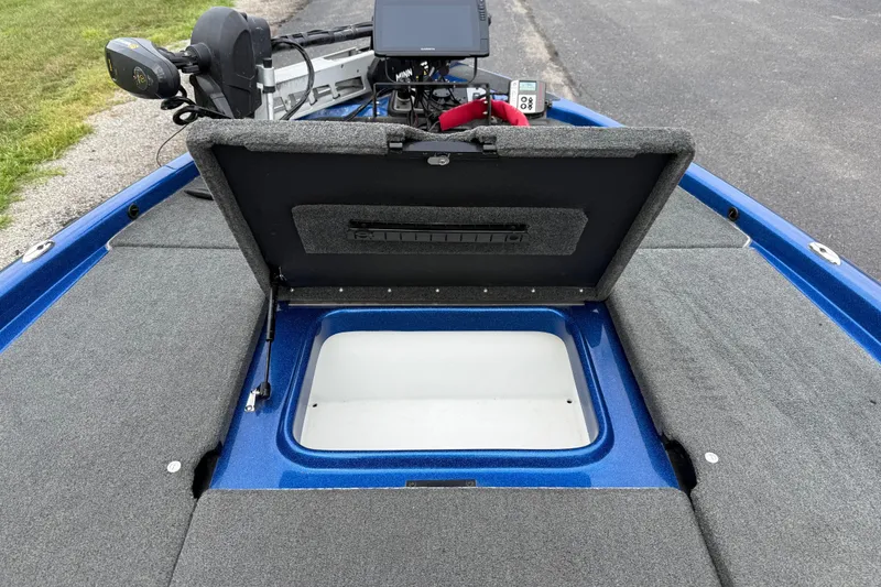 Slide: The Image of 2018 SKEER ZX190 boat with open storage compartment and fishing equipment. - 19