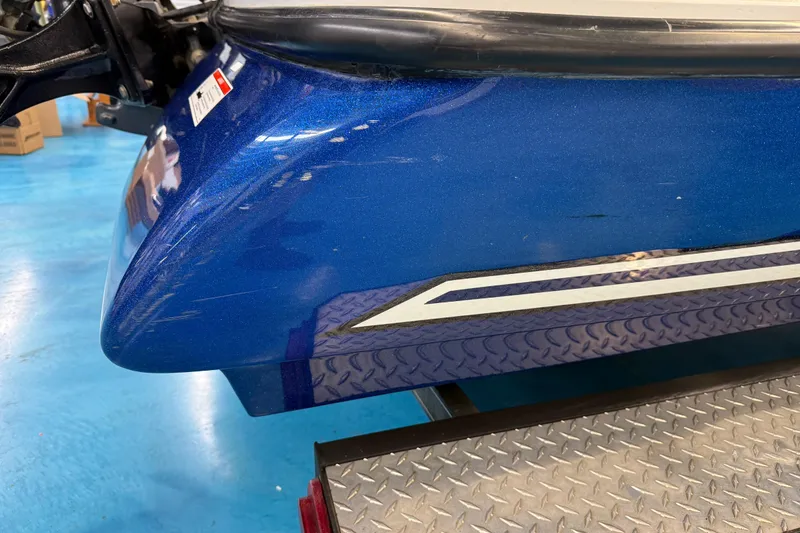 Slide: The Image of Blue SKEER ZX190 boat on a metal platform, 2018 model. - 23