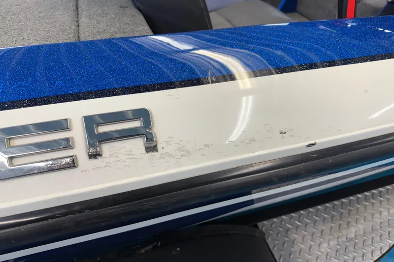 Slide: The Image of Close-up of 2018 SKEER ZX190 boat with blue and white detailing. - 26