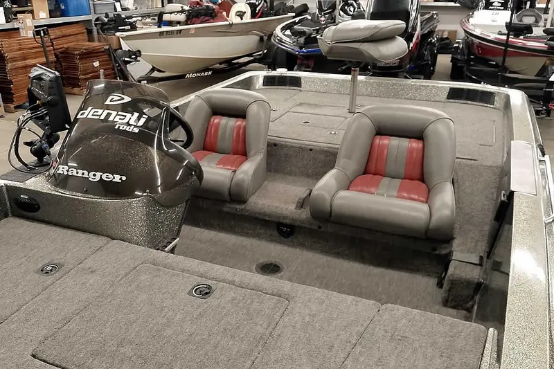 Slide: The Image of 1996 Ranger 487VS boat interior with dual seats and Denali rods branding. - 12