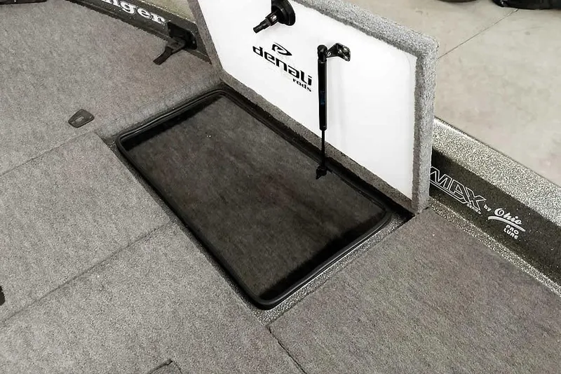 Slide: The Image of 1996 Ranger 487VS boat storage compartment with Denali rods branding. - 18