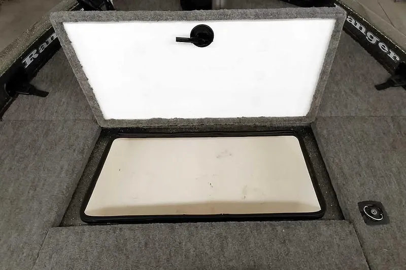 Slide: The Image of Open storage compartment on 1996 Ranger 487VS boat with carpeted interior. - 19