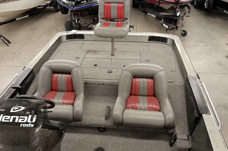 Slide: The Image of 1996 Ranger 487VS boat interior with red and gray seating, featuring Denali rods branding. - 24
