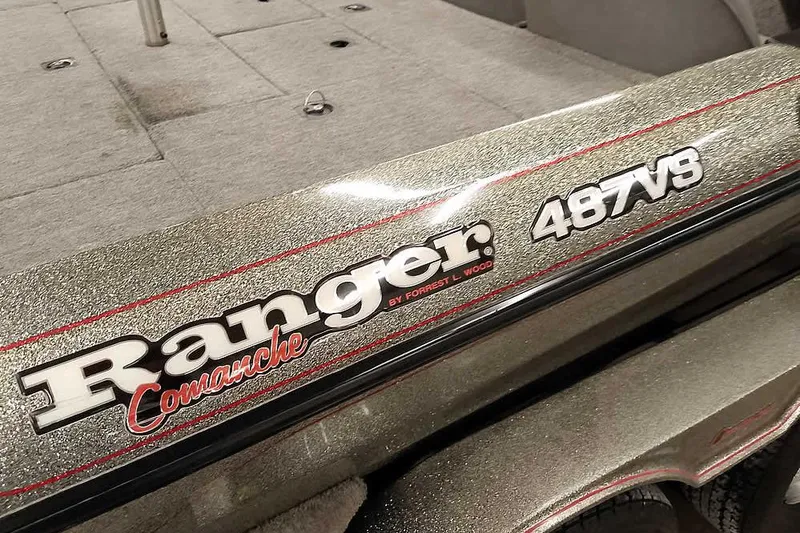 Slide: The Image of 1996 Ranger 487VS Comanche boat with metallic finish and red accents. - 5