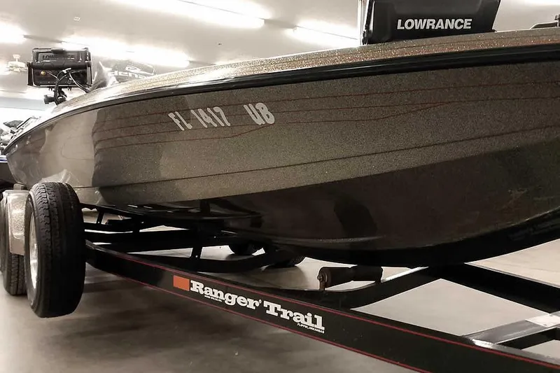Slide: The Image of 1996 Ranger 487VS boat on trailer with Lowrance equipment in a showroom. - 8