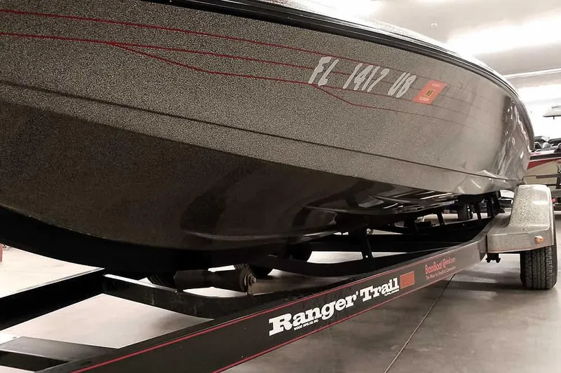 Slide: The Image of 1996 Ranger 487VS boat on a Ranger Trail trailer in a garage. - 9