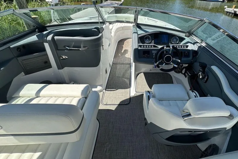 Slide: The Image of Interior of a 2016 Cobalt R5 boat with luxurious seating and modern dashboard. - 9