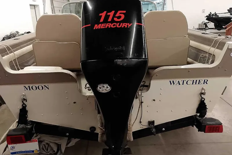 Slide: The Image of 2005 Monark King 185 boat with Mercury 115 outboard motor, named "Moon Watcher." - 14