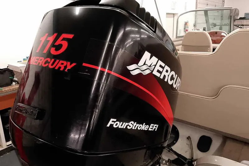 Slide: The Image of Mercury 115 FourStroke EFI outboard motor on 2005 Monark King 185 boat. - 2