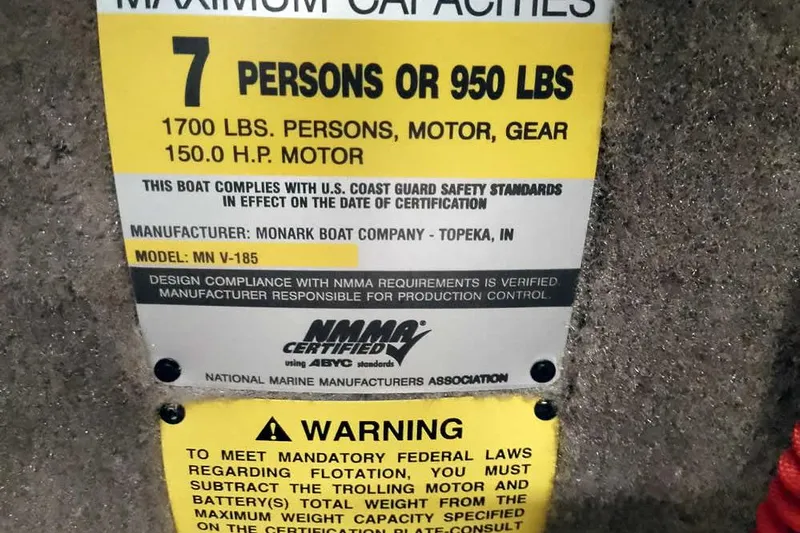 Slide: The Image of Monark King 185 boat capacity label, 7 persons or 950 lbs, 150 HP motor, 2005 model. - 24