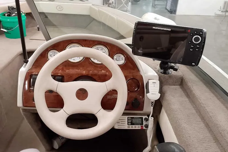 Slide: The Image of Steering console of 2005 Monark King 185 boat with Humminbird fish finder. - 25