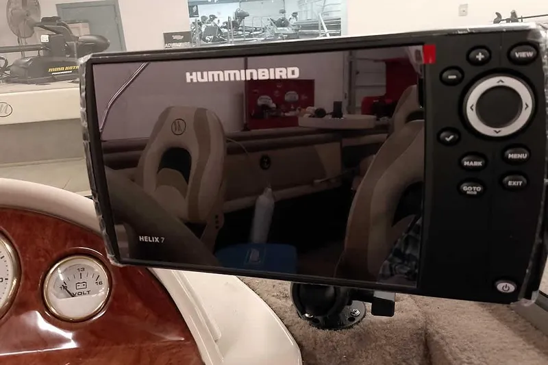 Slide: The Image of Humminbird Helix 7 fish finder on Monark King 185 boat dashboard, 2005 model. - 26