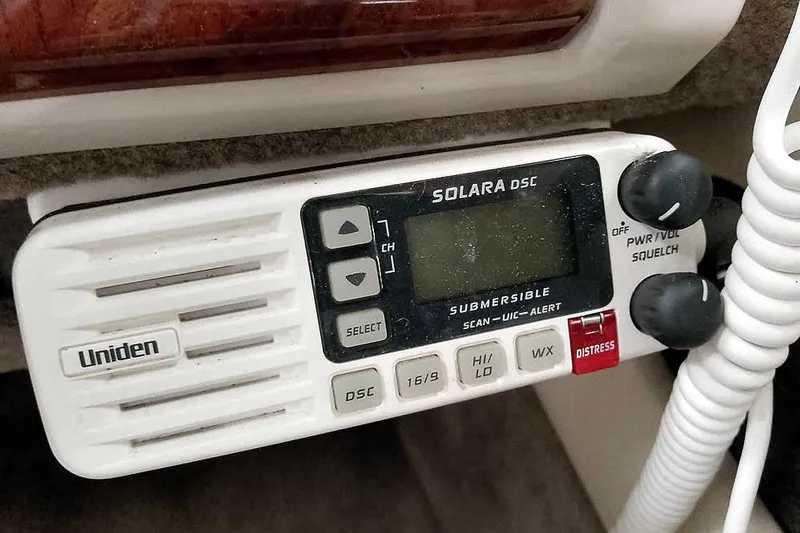Slide: The Image of Uniden Solara DSC marine radio in a 2005 Monark King 185 boat cockpit. - 27