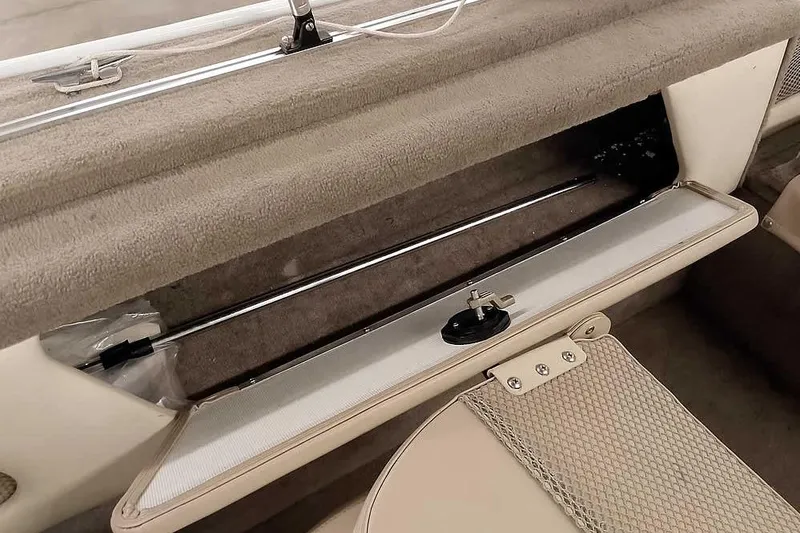 Slide: The Image of Open storage compartment in 2005 Monark King 185 boat interior. - 29