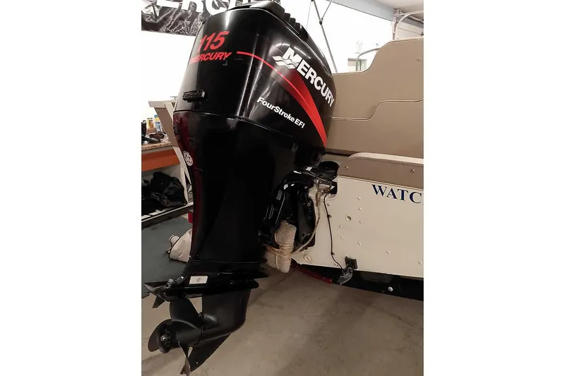 Slide: The Image of 2005 Monark King 185 boat with Mercury 115 FourStroke EFI outboard motor. - 3