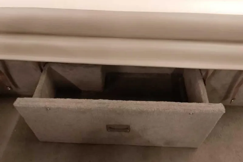 Slide: The Image of Open storage compartment in a 2005 Monark King 185 boat interior. - 32