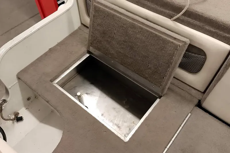 Slide: The Image of Open storage compartment in a 2005 Monark King 185 boat interior. - 35