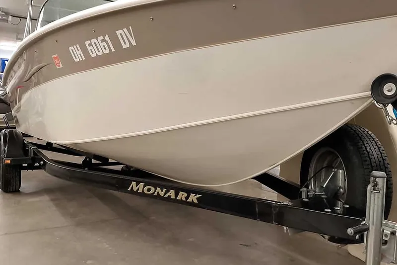 Slide: The Image of 2005 Monark King 185 boat on trailer, displaying registration number OH 6061 DV. - 6
