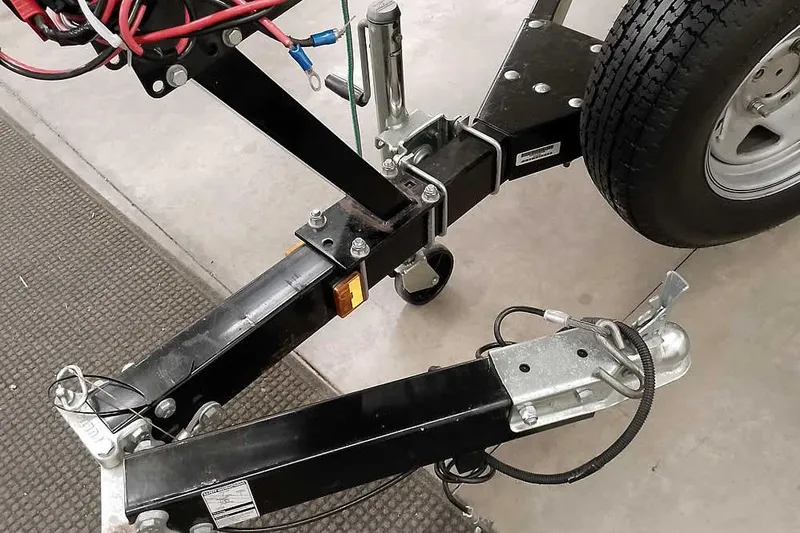 Slide: The Image of Trailer hitch and wheel assembly of a 2005 Monark King 185. - 9