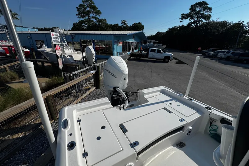 Slide: The Image of 2024 Tidewater 2300 Carolina Bay boat with Mercury engine at a marina. - 17