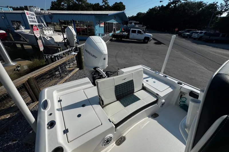 Slide: The Image of 2024 Tidewater 2300 Carolina Bay boat with Mercury engine at a marina. - 18
