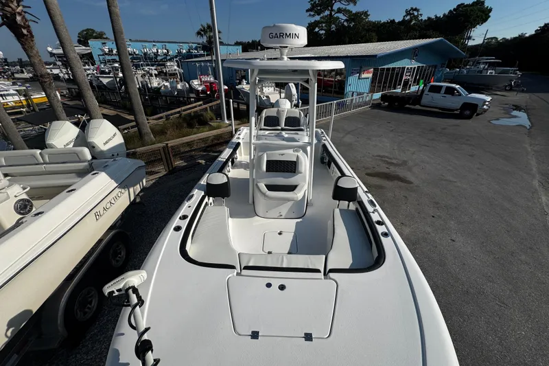 Slide: The Image of 2024 Tidewater 2300 Carolina Bay boat at marina, featuring Garmin equipment. - 9