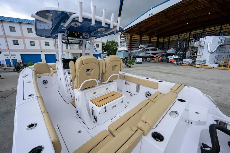 Slide: The Image of 2026 Sportsman Heritage 261 Center Console boat in a marina setting. - 10